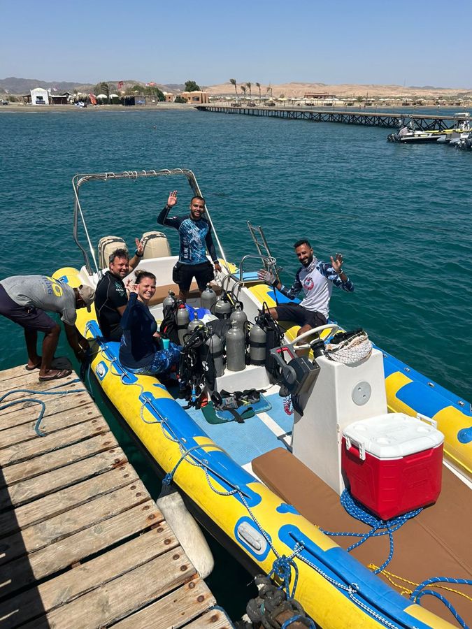 A group of divers and guests with Mahmoud on one of our trips.