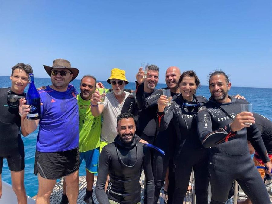 A group of divers and guests with Mahmoud on one of our trips.