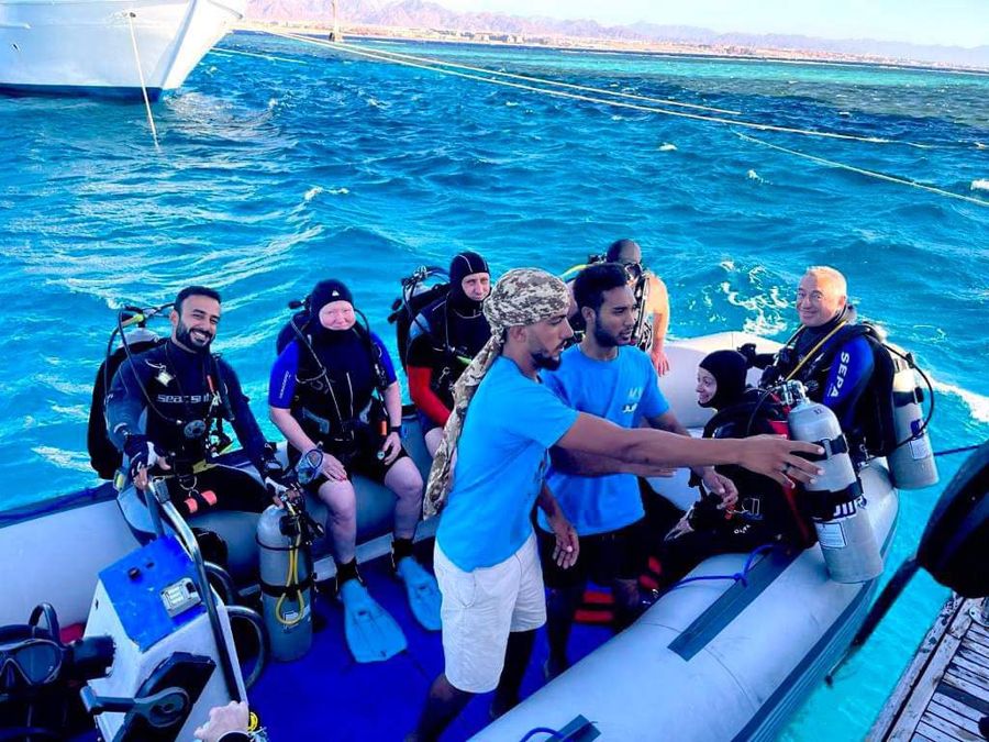 A group of divers and guests with Mahmoud on one of our trips.