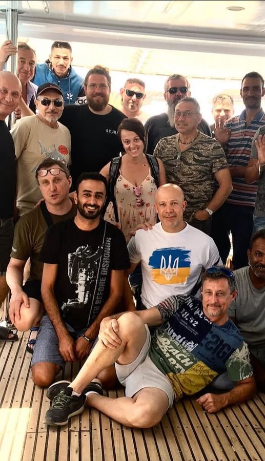 A group of divers and guests with Mahmoud on one of our trips.