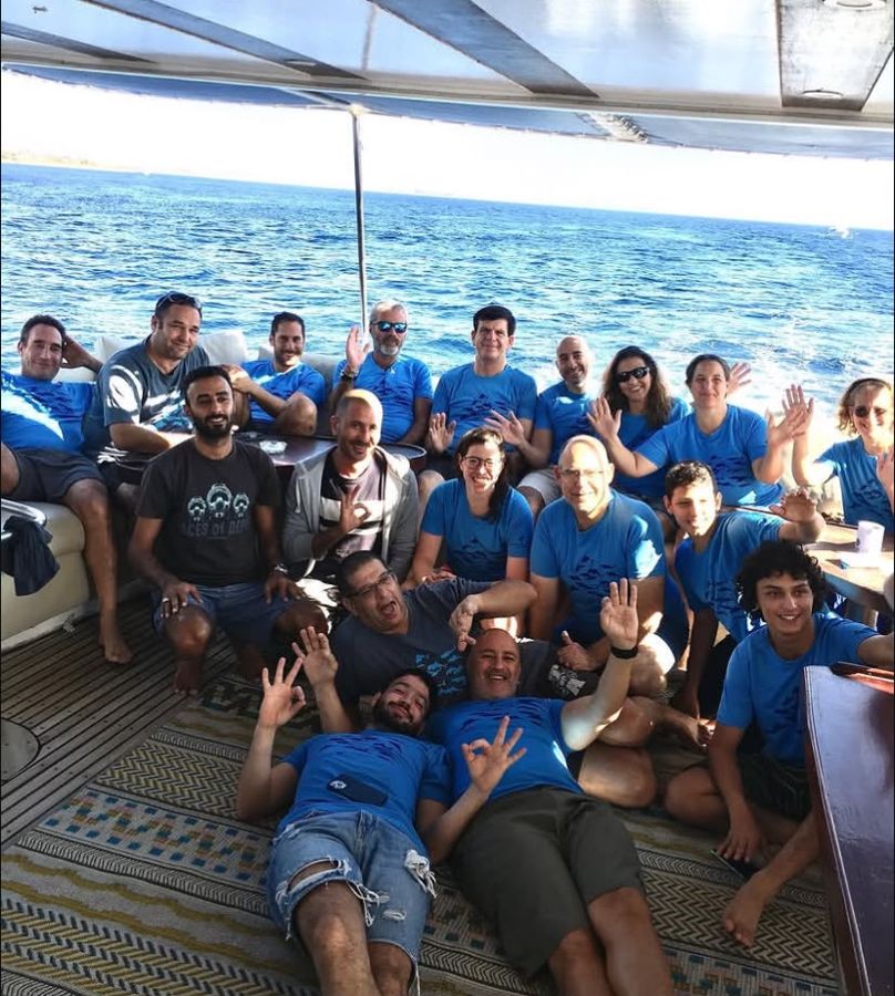 A group of divers and guests with Mahmoud on one of our trips.
