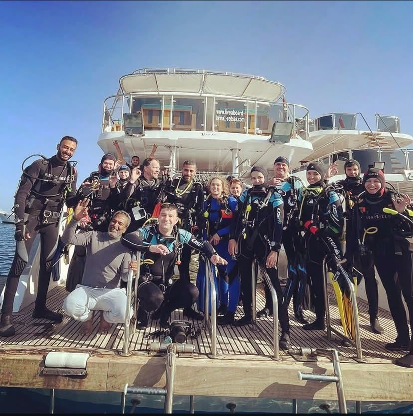 A group of divers and guests with Mahmoud on one of our trips.