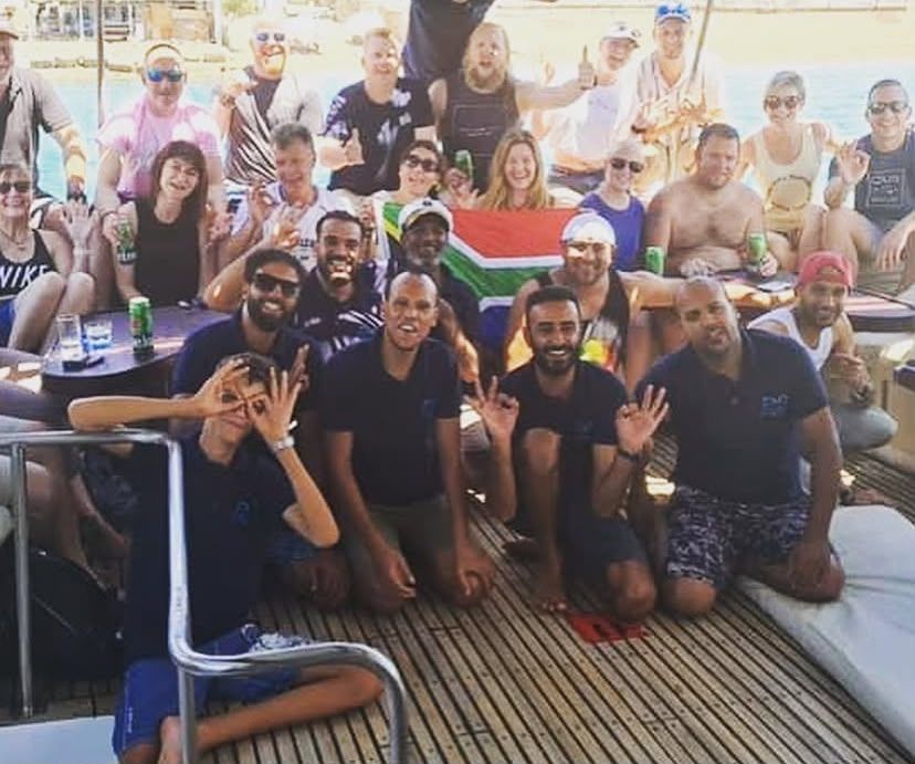 A group of divers and guests with Mahmoud on one of our trips.