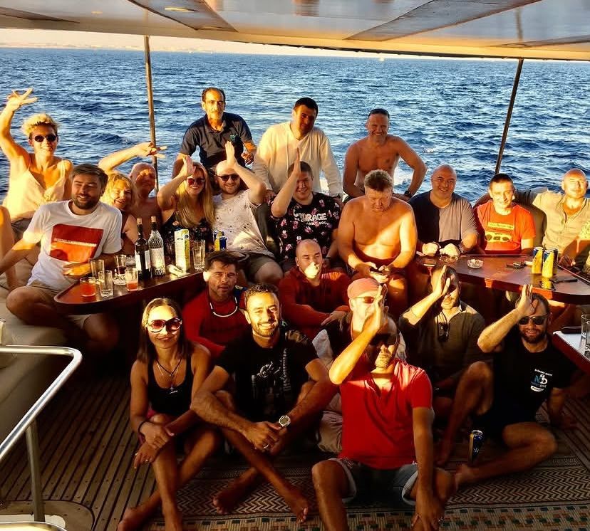 A group of divers and guests with Mahmoud on one of our trips.