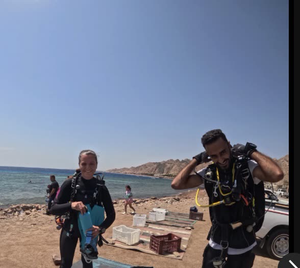 Dive guides kitting up before a dive.